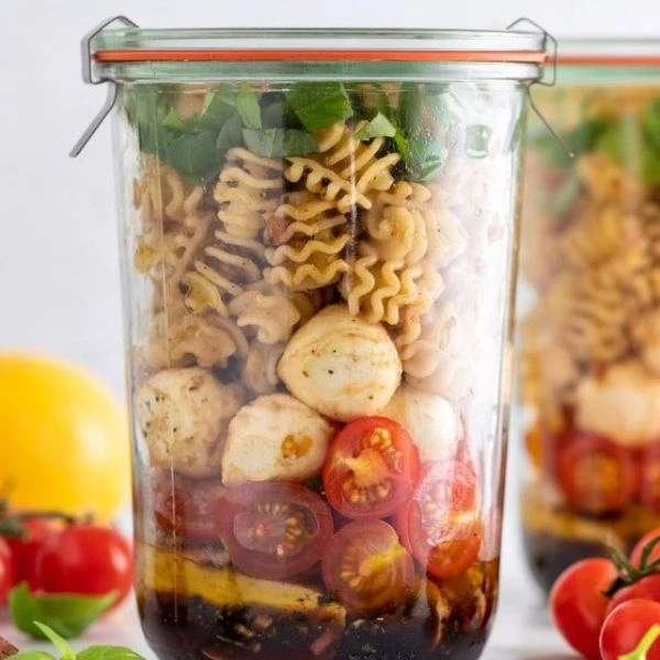 Image of to go meal prepping option of a pasta salad in a tall container
