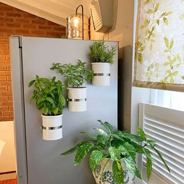 This image is of a fridge decor idea with plants to add a touch of greenery.
