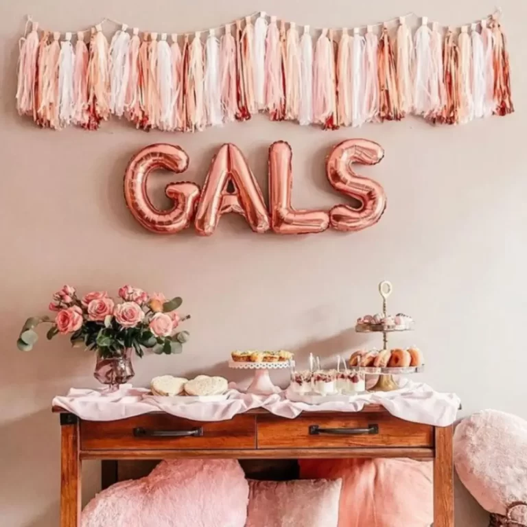 photo of galentines day balloons and a table setup with food