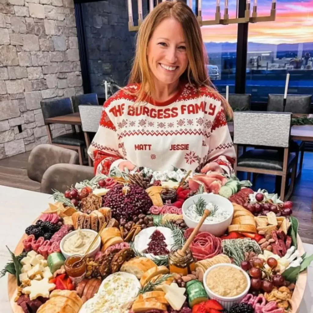 photo of a women with a charcuterie board setup