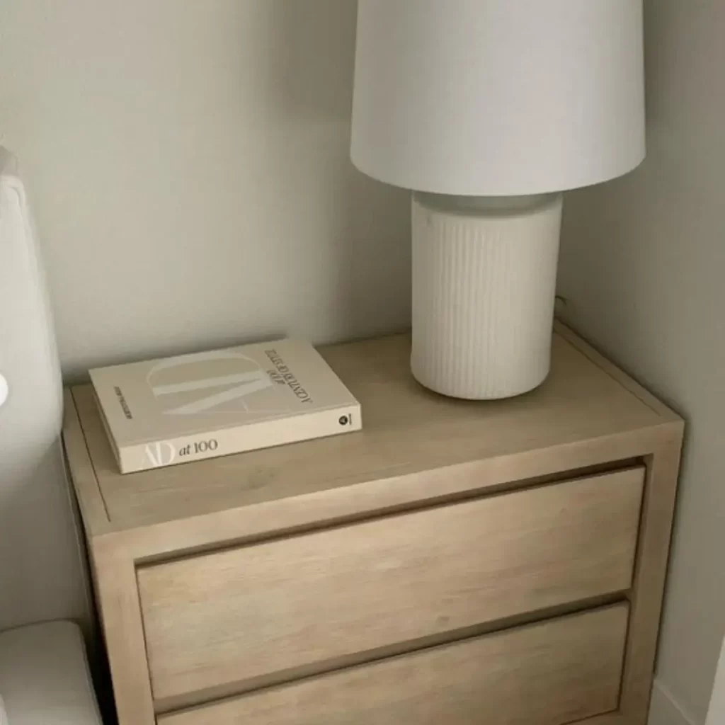 This photo is of a minimalist dorm room nightstand
