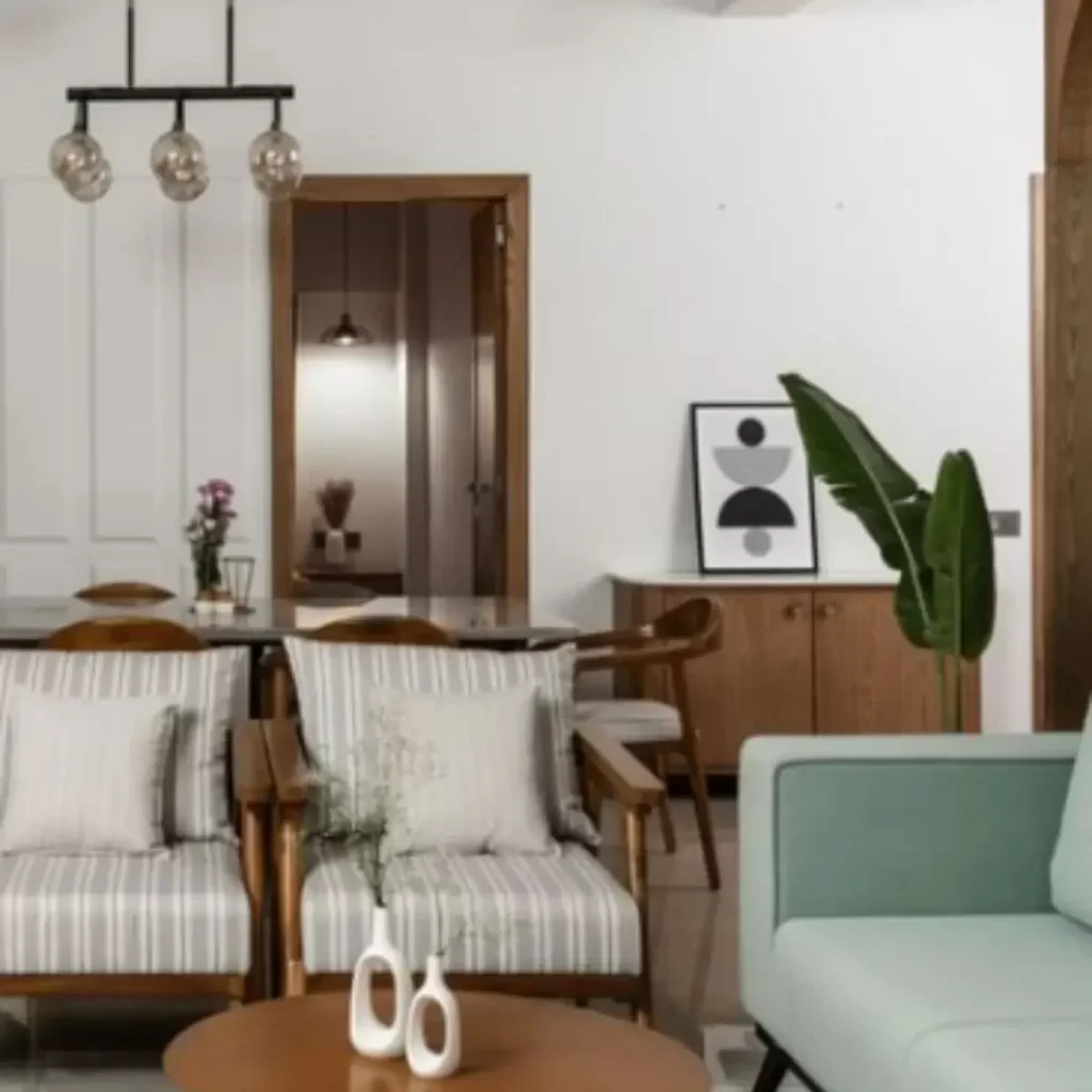 this photo is of a home with white and green accents. The couch is perfect for friends.