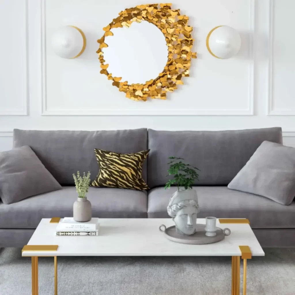 image of a center piece wall mirror in gold with two lights on either side